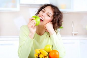 dieting-concept-healthy-food-young-woman-eats-fresh-fruit-2