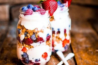 granola-parfait-with-yogurt-and-berries-on-rustic-background-2